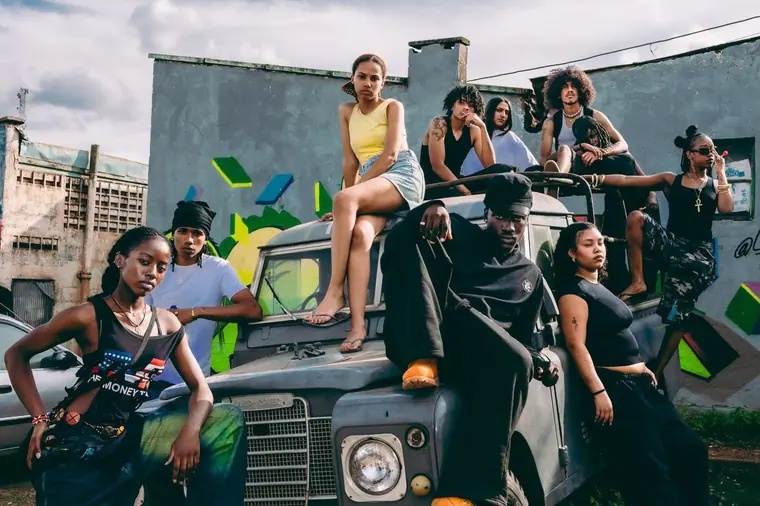Styled portrait against a painted wall in Kibera, from the Still Here series